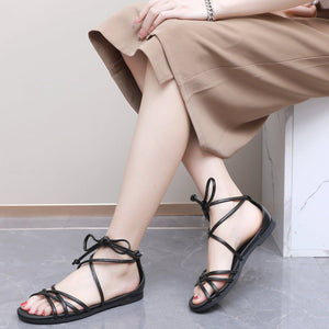"Elevate Your Look: Piccadilly Black Flat Strappy Lace-up Sandals" (418.060)